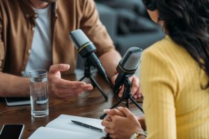 Cropped,View,Of,Two,Radio,Hosts,Recording,Podcast,In,Broadcasting